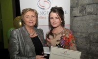 Susanne Stokes receives her Award from Minister Fitzgerald