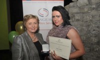 Cassie Stokes receives her Award from Minister Fitzgerald