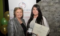 Donna Stokes receives her Award from Minister Fitzgerald