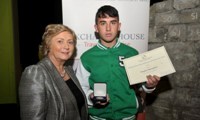 Hughie Maughan receives his Award from Minister Fitzgerald