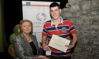 Martin O'Donnell receives his Award from Minister Fitzgerald