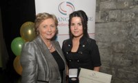 Breda Stokes receives her Award from Minister Fitzgerald