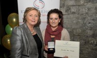 Priscilla McDonagh receives her Award from Minister Fitzgerald