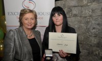 Cathleen Joyce receives her Award from Minister Fitzgerald