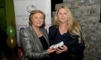 Minister Fitzgerald presents Bridget McInerney with a raffle prize of an MP3 player