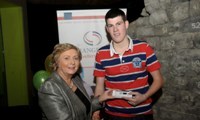 Minister Fitzgerald presents Martin O'Donnell with a raffle prize of an MP3 player