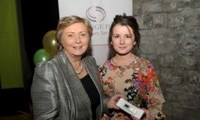 Minister Fitzgerald presents Susanne Stokes with a raffle prize of an MP3 player