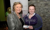 Minister Fitzgerald presents Shantelle Donegan with a raffle prize of an MP3 player